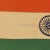 This vintage Indian flag is made from a wool cloth with printed design visible on both sides. Please note staining and...