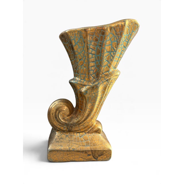 A striking vintage ceramic vase featuring an expressive, sweeping silhouette, curled sculptural detail, and a richly...