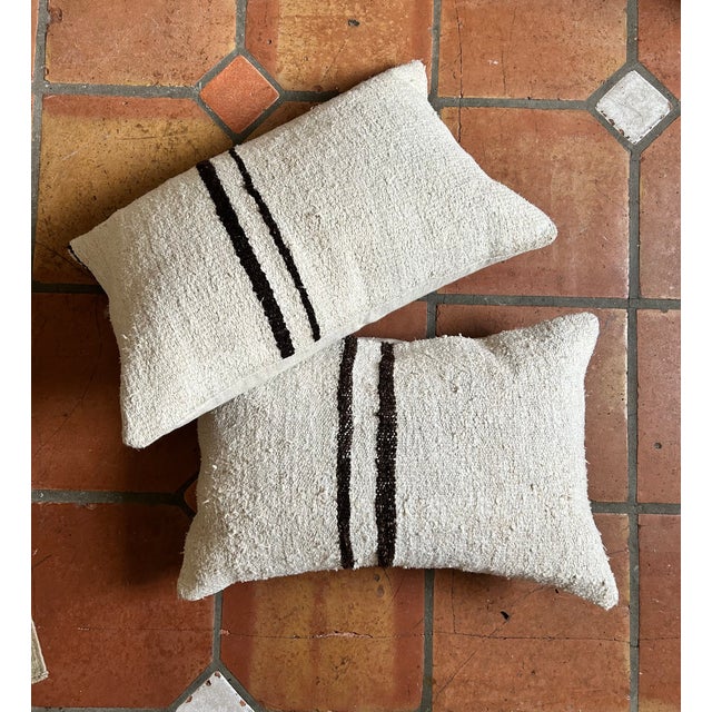 Pair of Vintage Handmade Turkish Kilim Hemp Pillows. In wonderful condition. Has a down fill insert. Traditionally many...