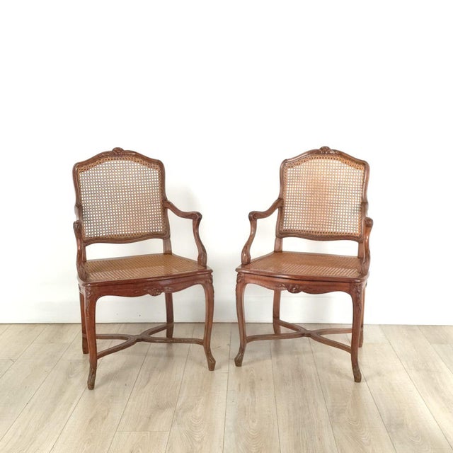 A pair of French Régence-style armchairs, 19th century. Seat height 20" with cushion, 17.75" without. Two pairs available.