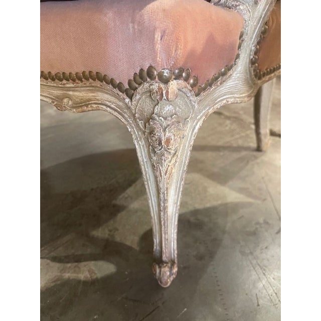 This pair of French Louis XV painted chairs is a luxurious addition to any home. Upholstered in a gorgeous pink velvet,...