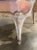 This pair of French Louis XV painted chairs is a luxurious addition to any home. Upholstered in a gorgeous pink velvet,...
