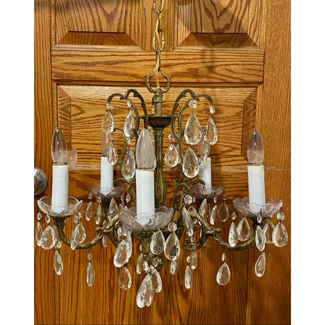 Width : 19” Height: 20” Chain: 10” Dazzle your space with this captivating vintage-style crystal chandelier. Featuring an...