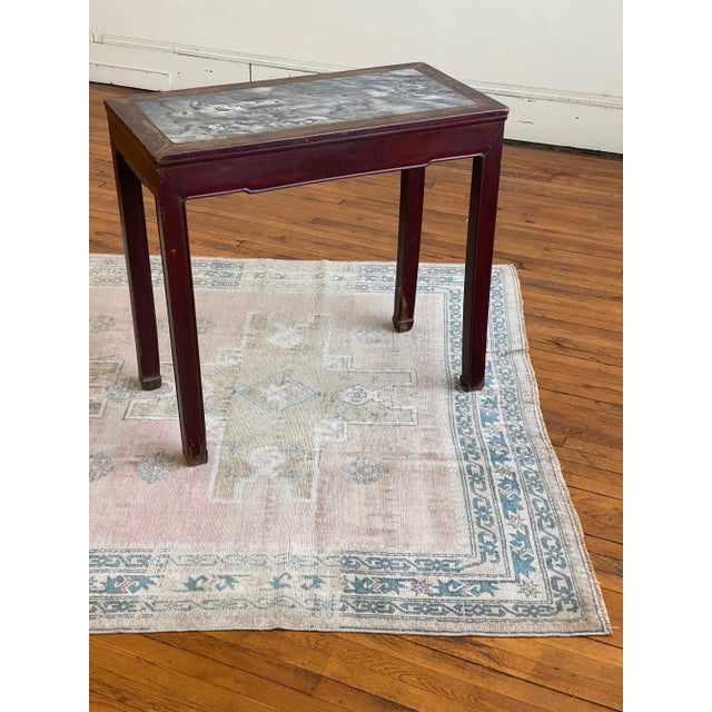 Lots of character in this circa 1720 Chinese wine table. Nice as a small desk or console. The stone top has three very old...