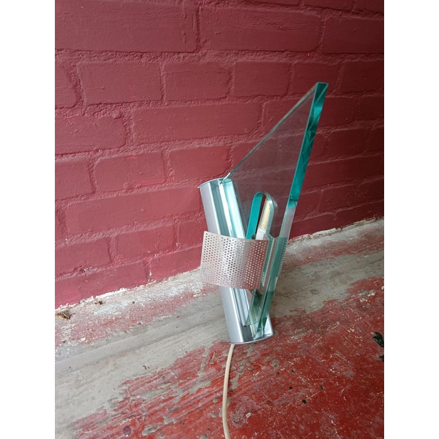 Artemide wall lamp Icaro from Italy. Designed by the famous designer Carlo Forcolini. The frame is made of grey painted...