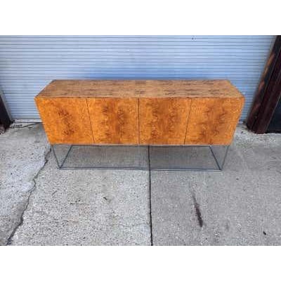 Milo Baughman for Thayer Coggin Olive Burl Wood Credenza or Cabinet with small square tubing that forms the base. Overall...