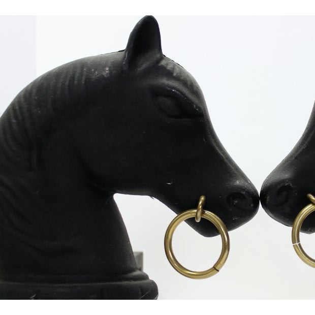 This is a vintage pair of horse head bookends made of iron. The pieces date back to the 1950s.
