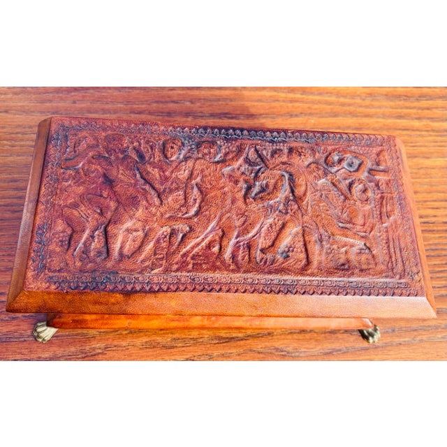 This is a handsome dark brown hand tooled Italian leather trinket box. The leather on this box has a neo classical...
