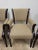 The 1970 Set of 4 Baker Ebonized Neoclassical Arm Chairs are fully assembled and feature a sleek black color, making them...