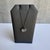 Enhance your jewelry collection with this exquisite Diamond Disc Necklace in 14kt Gold with Black Rhodium Plating....