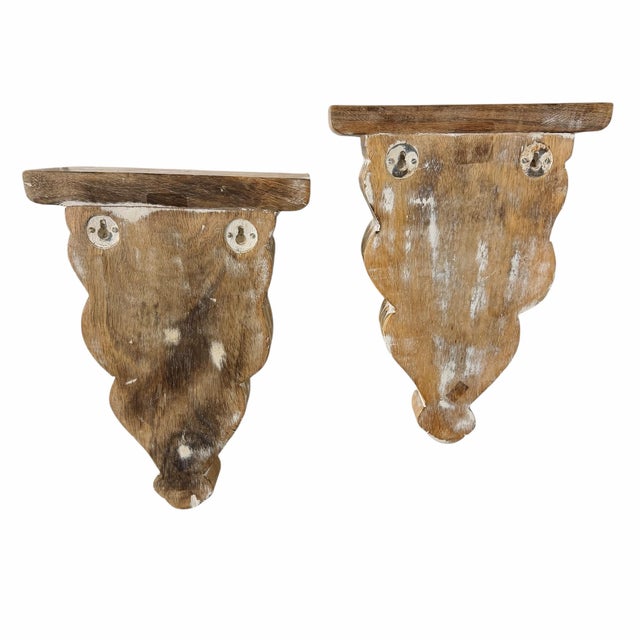 Offering this pair of vintage wooden hand carved decorative display wall brackets. Great way to show off collections and...