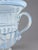 An elegant covered urn in hand-blown opalescent glass, probably Murano, Italy. The classically inspired form combines a...