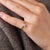 This elegant vintage solitaire engagement ring is centered by a GIA-certified old mine cut diamond weighing 0.91 carat....