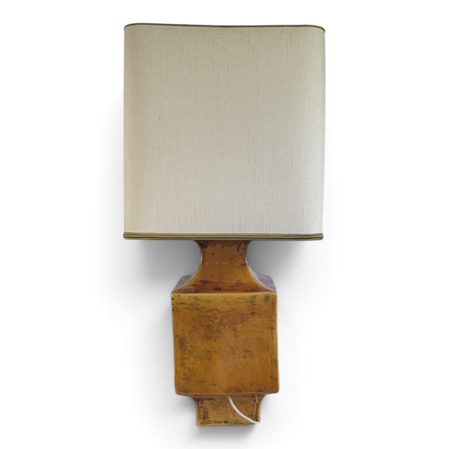 Mustard yellow glazed ceramic lamp with a floral diamond pattern — France, 1960s-1970s Important mustard yellow glazed...