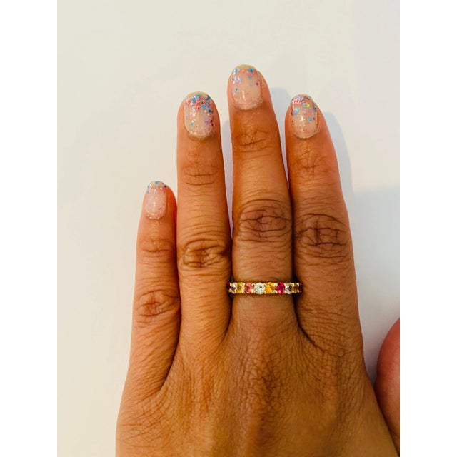 There are 17 Multicolor Natural Sapphires in this band that weigh 2.92 Carats. It is perfect for everyday wear and looks...