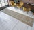 Vintage 1960s distressed Turkish Oushak rug runner. With beige field and shades of brown, ivory and tan throughout....