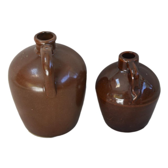 A matching pair of antique glazed stoneware "Little Brown Jugs", which are highly collectible examples of early 20th-...
