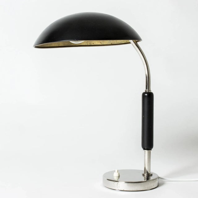 Cool functionalist table or desk lamp from ASEA, with smooth, graphic lines. Black wooden handle and black lacquered...