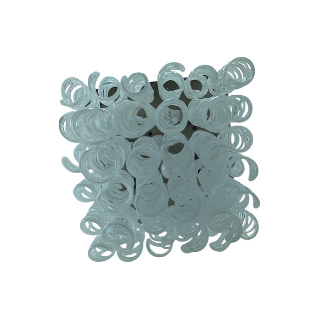 This refined chandelier embodies the elegance of Venetian craftsmanship through a contemporary and dynamic design. The...