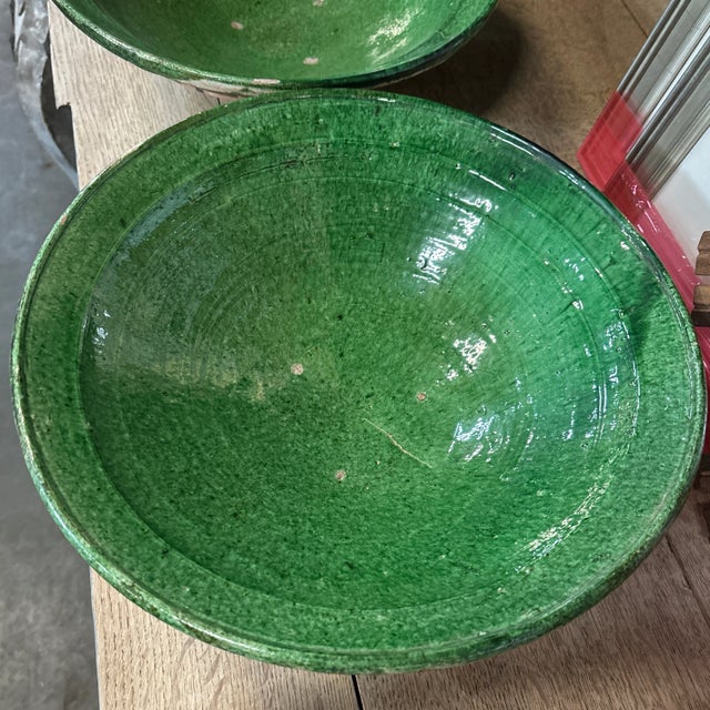 A pair of beautifully painted hand-thrown ceramic bowls from the late 20th century, Pakistan. These decorative bowls from...
