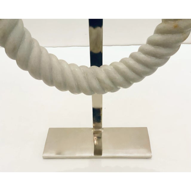 Elegant Large Modern Carved White Marble Ring Sculpture, polished nickel stand, showroom floor sample