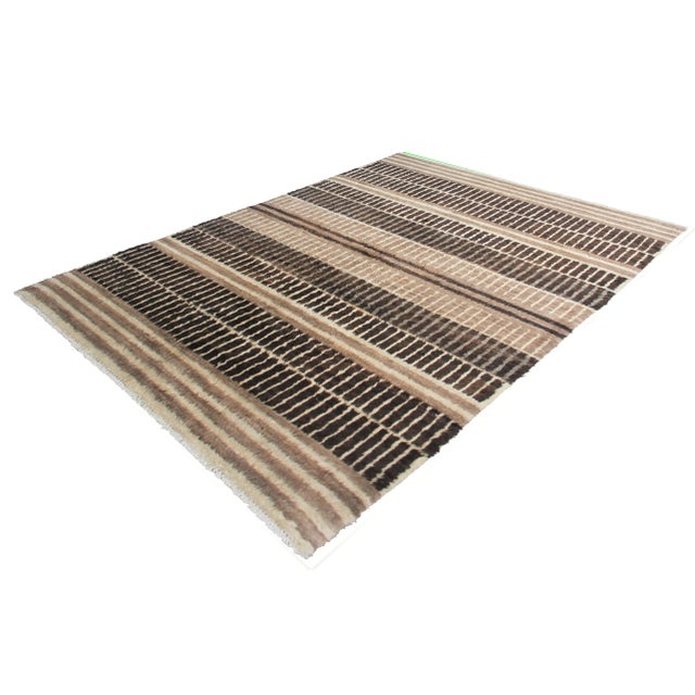 Hand knotted of top quality natural dyed wool and cotton in Afghanistan. This unique and innovative Navajo Rug is an eye-...