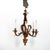 A late 19th-century French gilt tole six-light chandelier with scrolling acanthus, each arm ending in a stylized foliate...