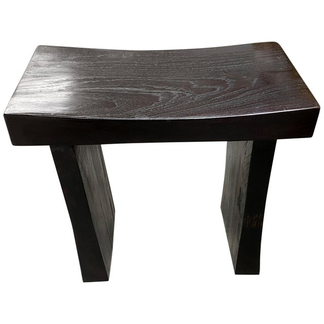 Sleek minimalist bench. Hand made from a thick single slab of reclaimed teak and finished with an espresso stain revealing...
