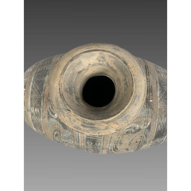 Polychrome terracotta vase, HU dynasty, Early Han (206 BC - 220 AD). Polychrome painted terracotta with archaic motifs in...