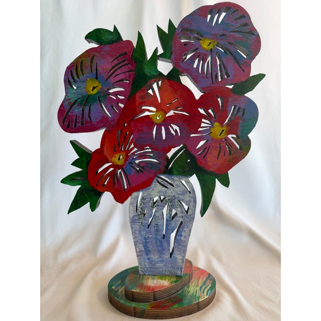 A vibrant and highly collectible limited edition wood sculpture by internationally acclaimed Israeli artist David...