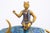 A vintage Chinese cloisonne sculpture depicts a golden-horned bull adorned in rich blue enamel decorated with intricate...