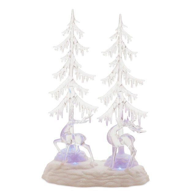 Brighten up your holiday decor with this Multicolored LED Deer and Trees display. Featuring wintry white tones and a chic...