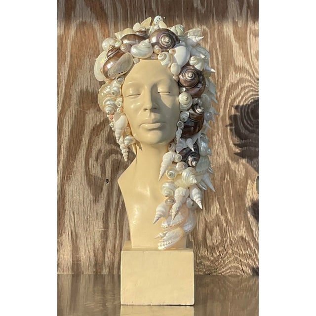An exceptional vintage Coastal bust of woman. A beautiful profile of a serene woman. A beautiful collection of shells wrap...