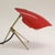 Rare red mid-century modern bedside lamp or table lamp with an adjustable plastic shade. Manufactured by wkr leuchten...