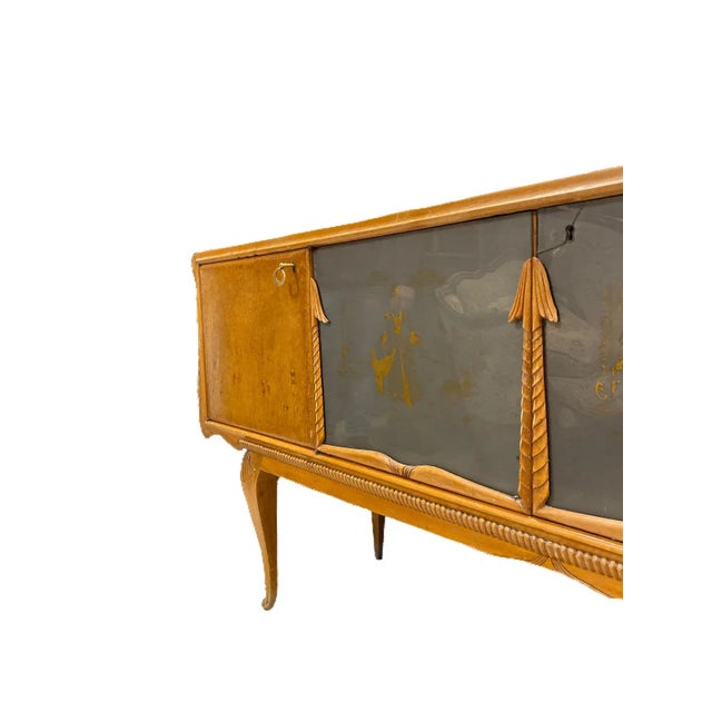 Low sideboard made of fine thuya wood root, with its unmistakable golden grain. Two wooden doors and two made of...