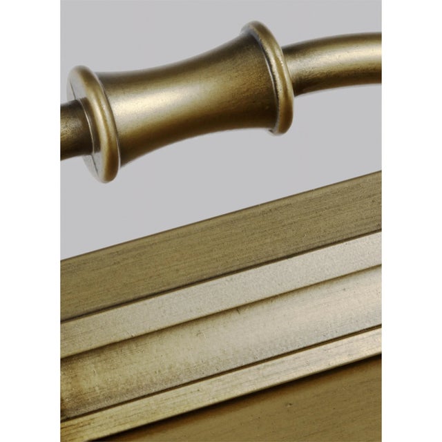 The Sean Lavin Wellsworth four light outdoor wall fixture in painted distressed brass enhances the beauty of your...