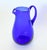 Lovely large cobalt blue blown glass pitcher with applied handle. Polished pontil mark on the bottom. It features a nice...