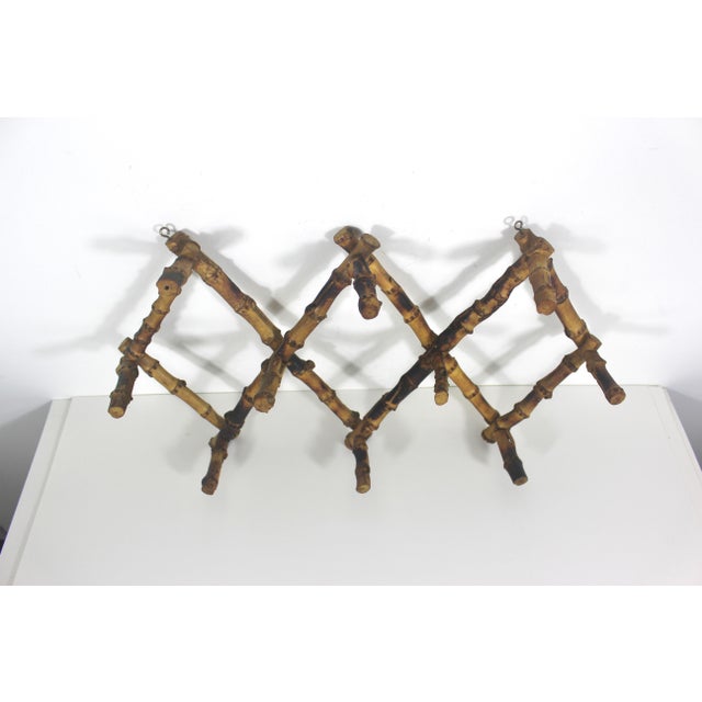 Fabulous Victorian style burnt bamboo accordion wall rack for coats, hats, jewellery, etc. has two hooks for hanging. Ten...