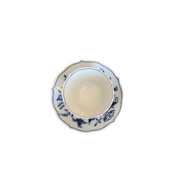 This elegant vintage Meissen espresso cup and saucer in the classic blue onion pattern is the perfect little luxury for...