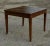 Square table with spiked stems plated in italian walnut from the early 1800s. The drawer is missing and the top has a...