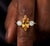 Add a touch of sunny elegance to your collection with this captivating three-stone ring, This design showcases a brilliant...