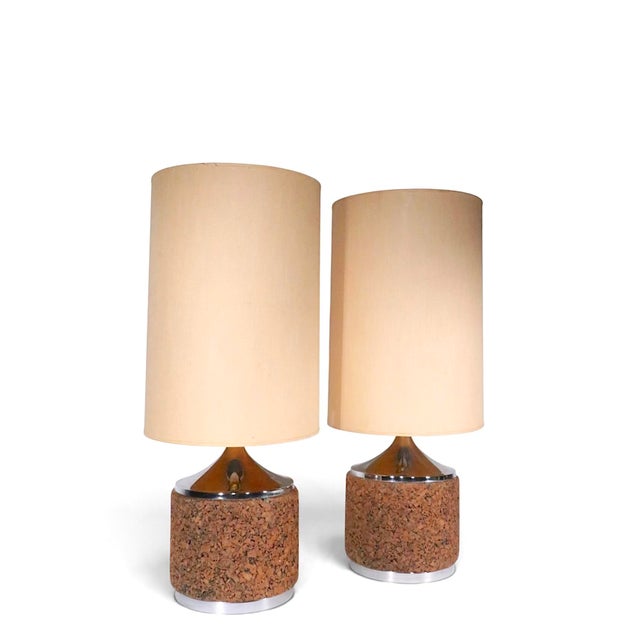 Exceptional pair of Mid Century table lamps, having cork and chrome bases, with original large drum shades. Both lamps are...