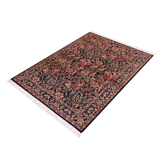 Designed with mesmerizing intricacy and gorgeous color palette, this hand-knotted masterpiece demonstrates the beauty and...