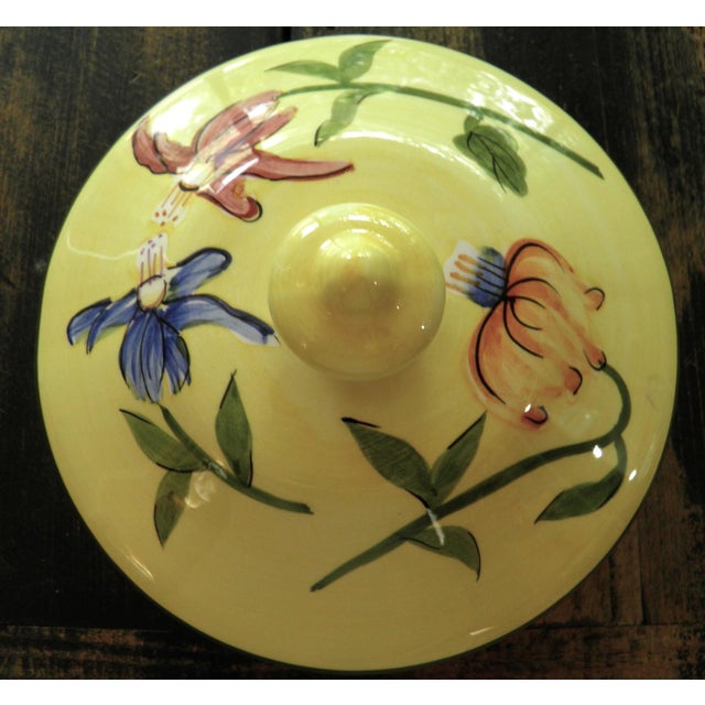 The Vintage Nonni’s Biscotti Jar is a handmade, large ceramic cookie jar canister with a charming yellow floral pattern....