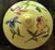 The Vintage Nonni’s Biscotti Jar is a handmade, large ceramic cookie jar canister with a charming yellow floral pattern....