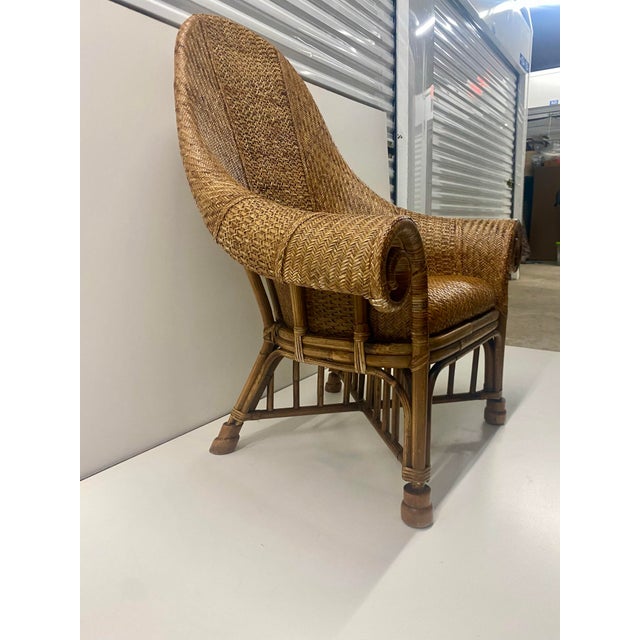 Bamboo arm chair attributed to Ralph Lauren , constructed from bamboo wicker and Leather covered with woven rattan in a...