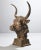 A commanding cast iron bull sculpture with a weathered, time-earned patina that speaks to strength and endurance....