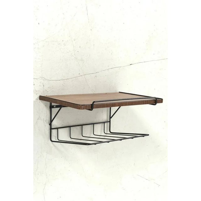 Useful wall shelf with a top that looks like wood veneer but actually it is a sticker. Back in the days it was used as a...