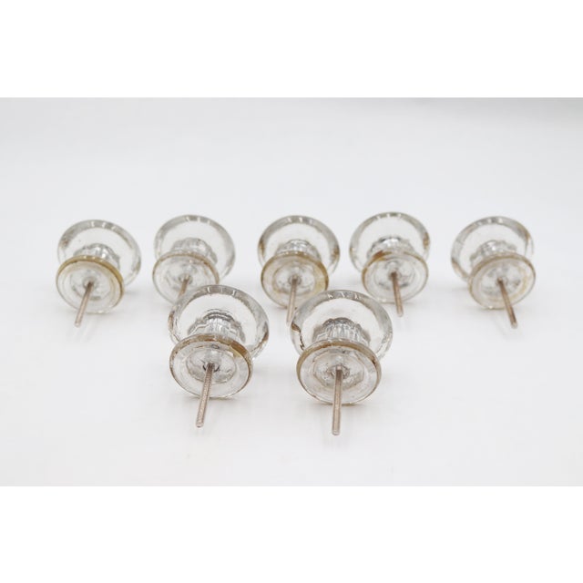 Vintage clear round glass cabinet or drawer pulls paired with steel screws. The original mounting nuts are not included....