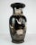 Ceramic vase with black glaze and decorated with flowers. The vase is in great vintage condition.